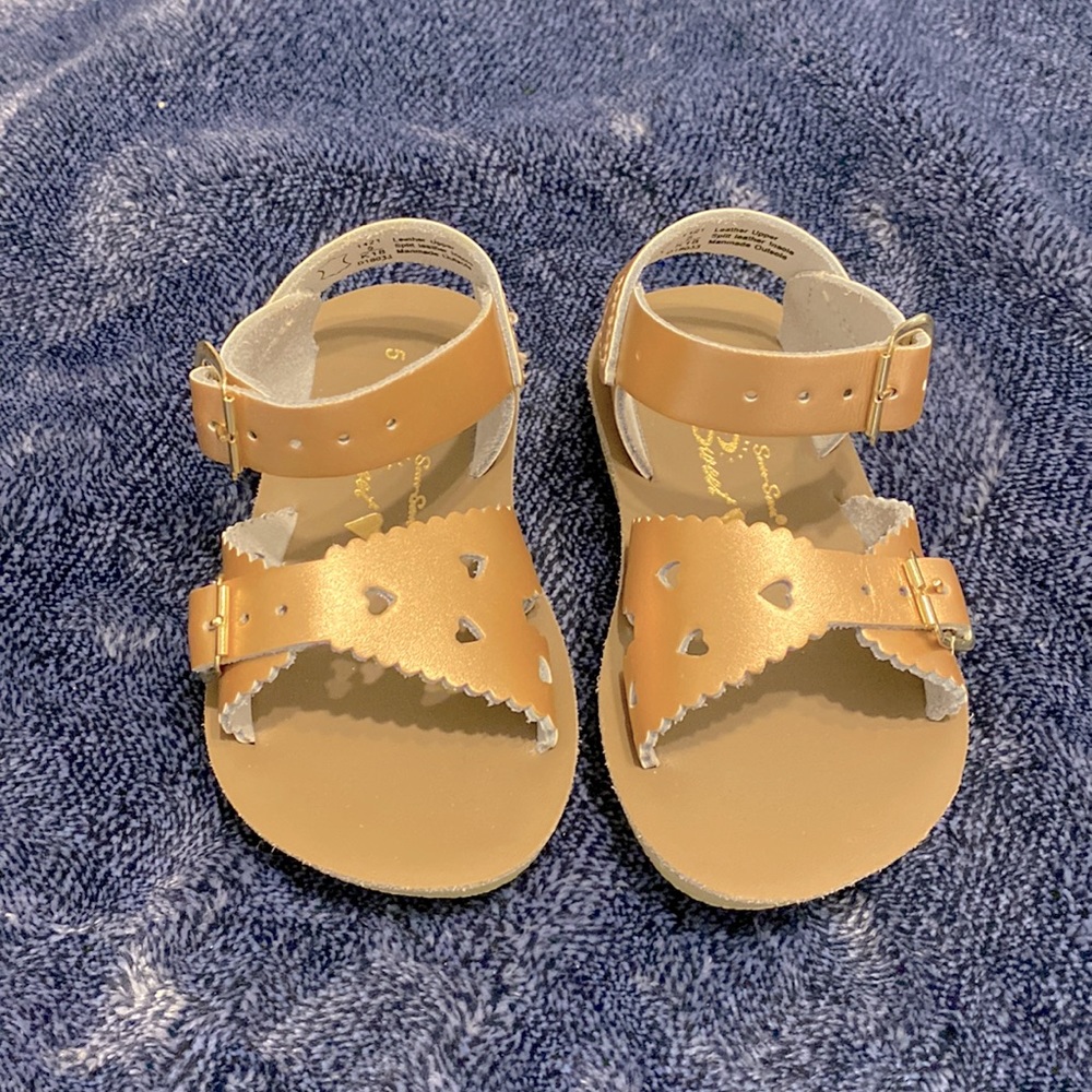 Sweet rose gold toddler sandals with cutout hearts